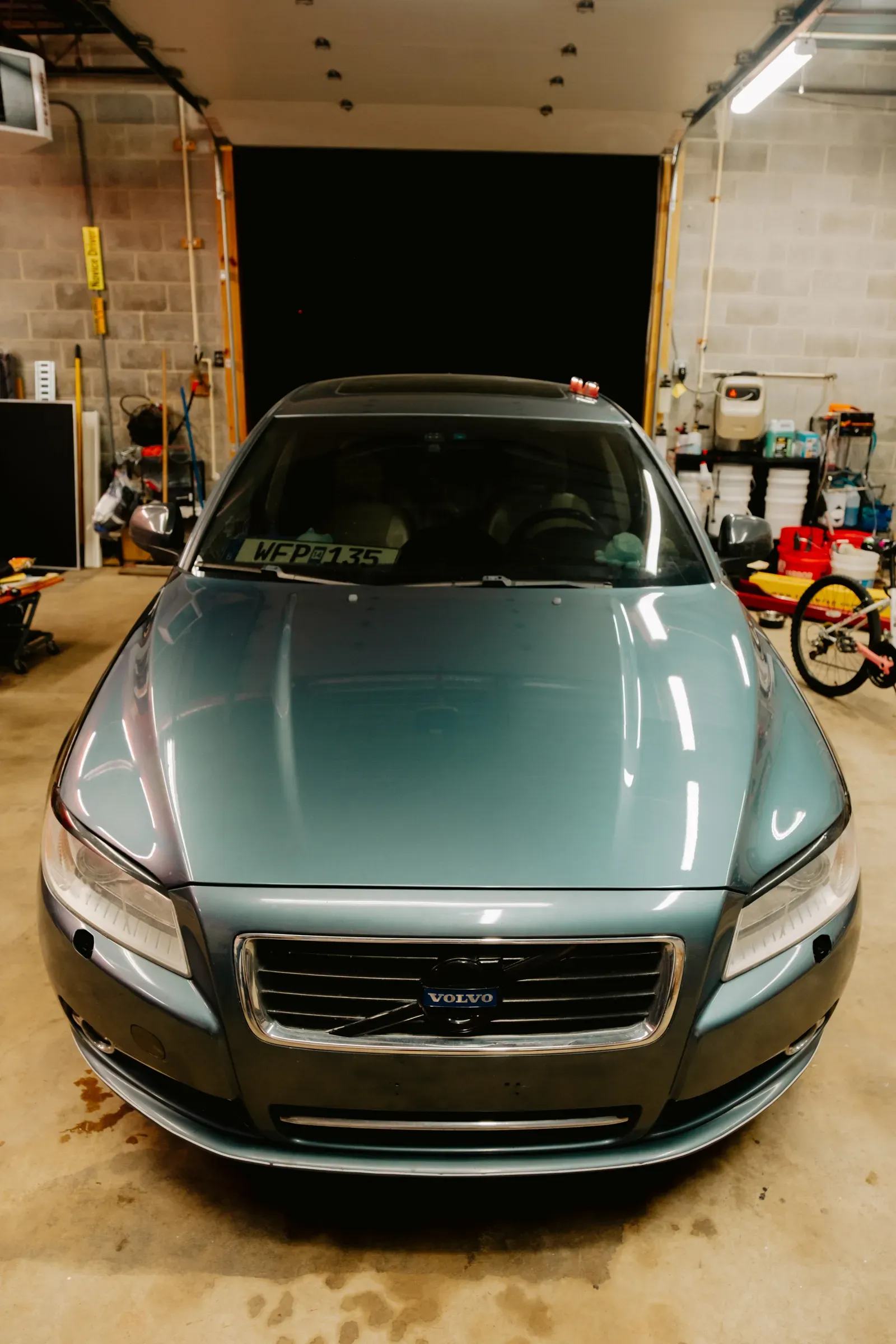 Corrected paint reflecting studio lights after a multi-stage polish
