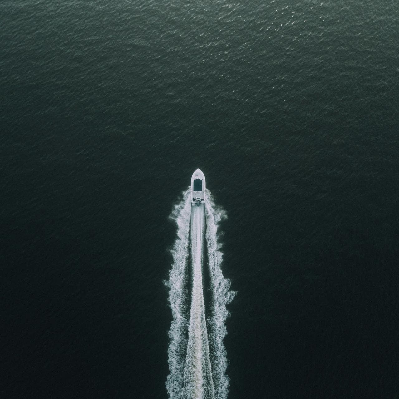 Aerial view of a powerboat running across open water