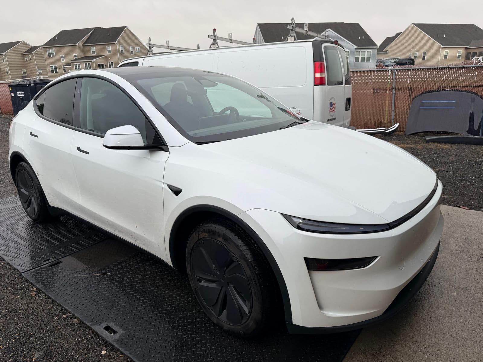 White Tesla at the Dynamite Details studio ready for a full detail