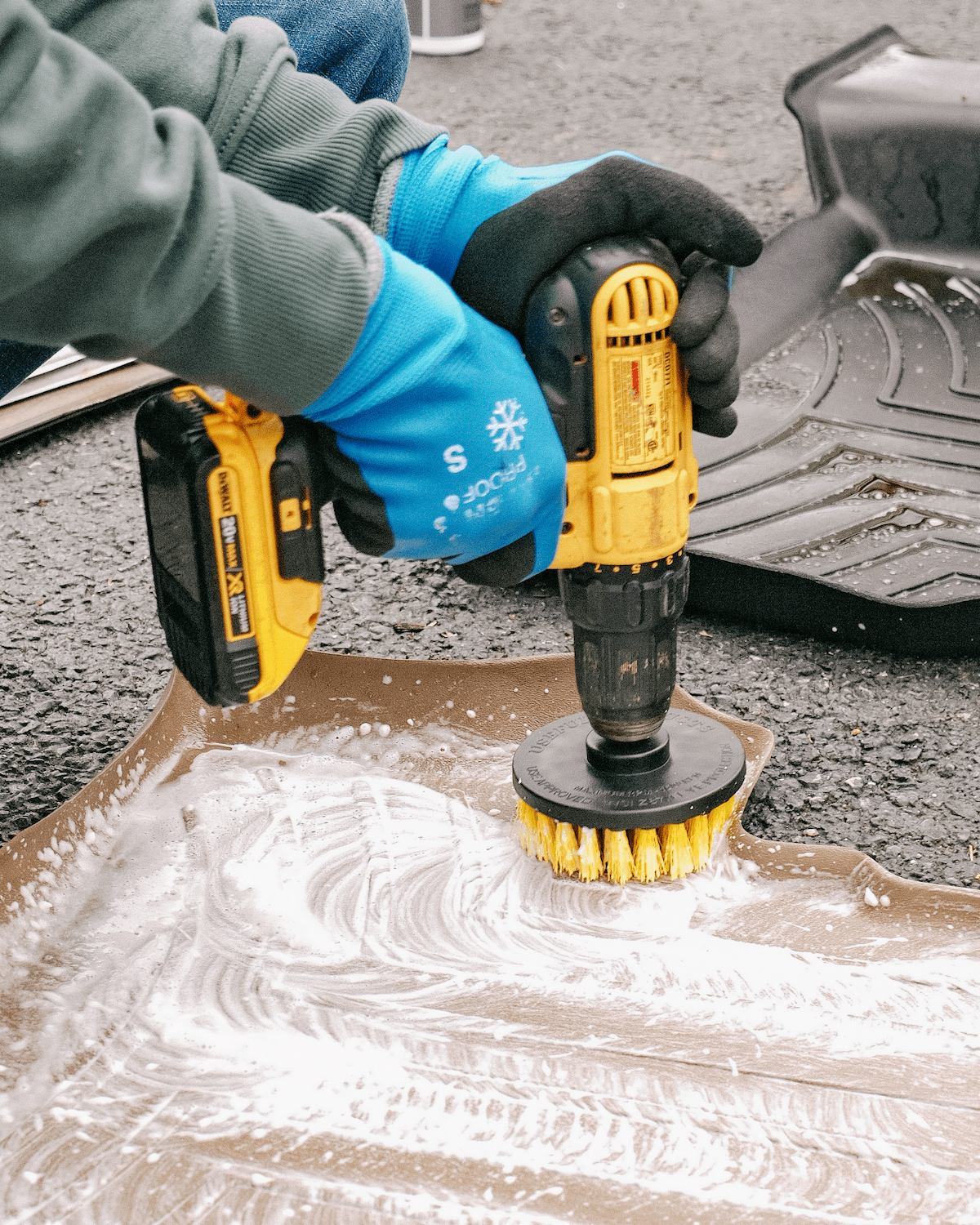 Non-toxic cleaning solution foaming on a weather floor mat